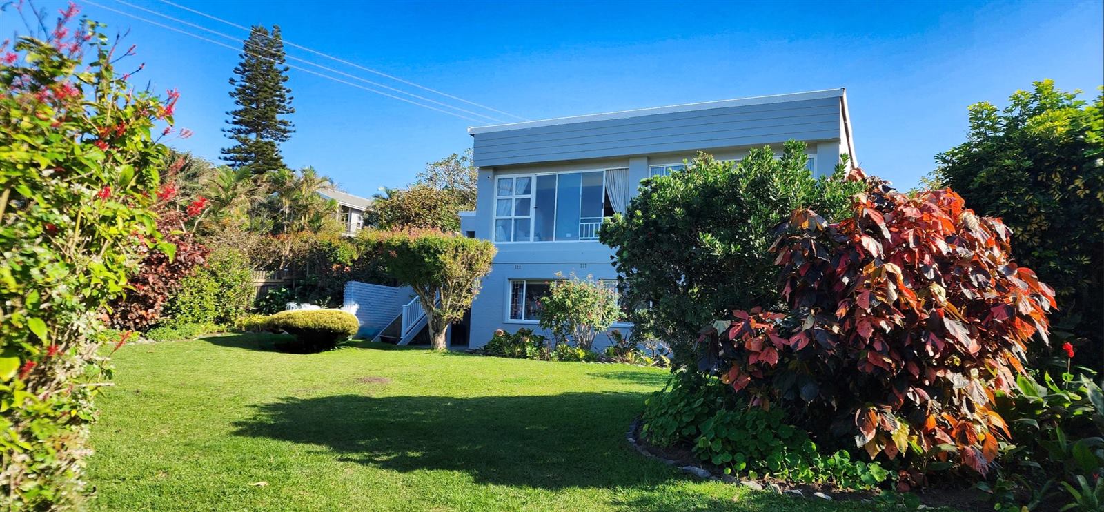 Sheila's Place, a double-storey holiday home in a lush garden